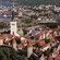 A medieval wall with towers surrounds Old Town Tallin